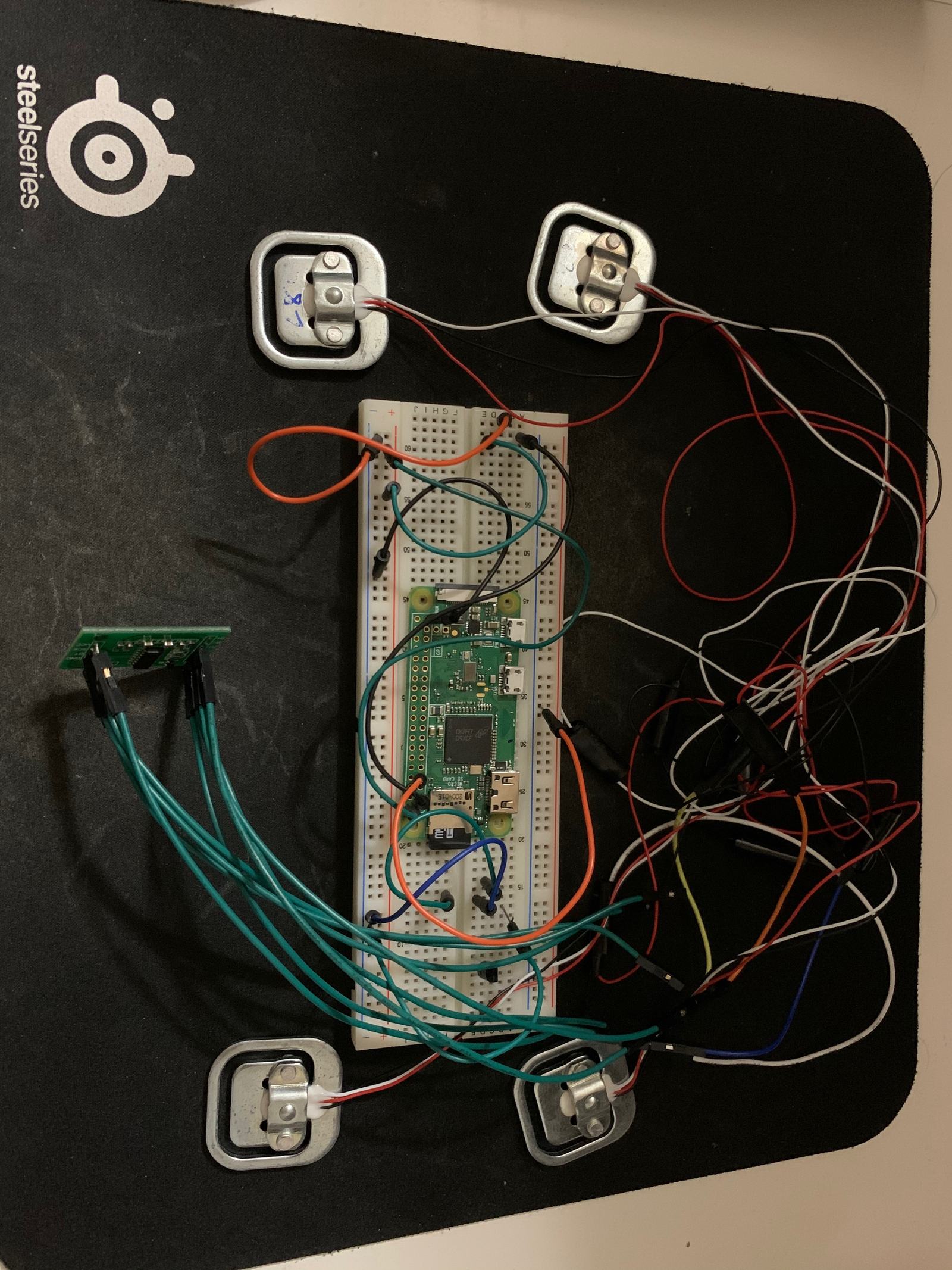 The bridge circuit for the load cells, wired up on protoboard.
