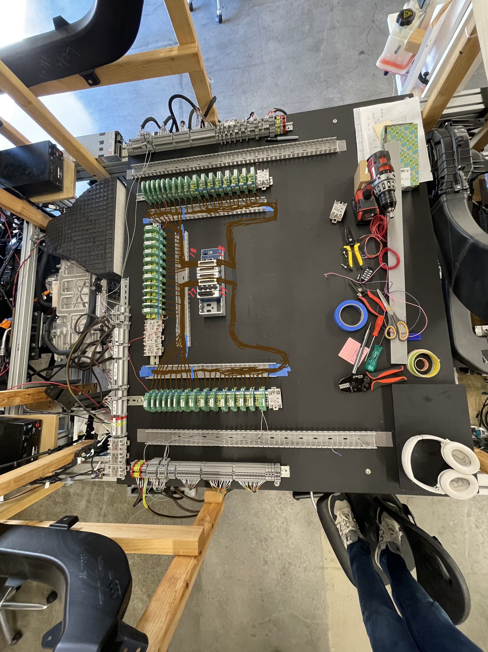 The thermal bench panel part way through wiring: relays and terminal blocks on DIN rail, with the routing drawn on in marker.