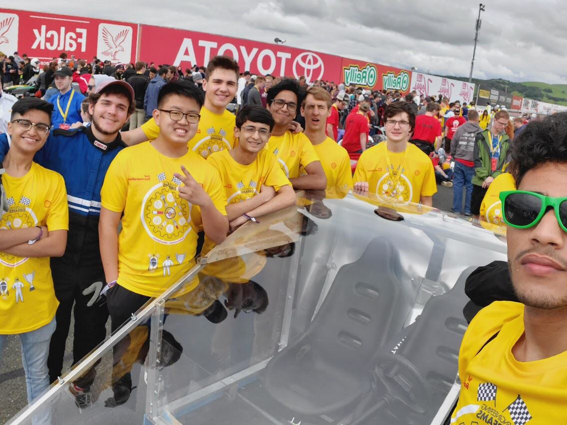 The team with the car at the event.